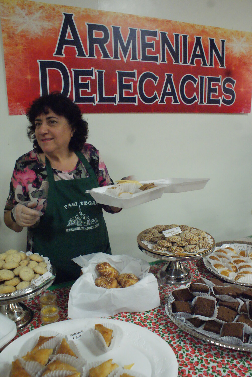 PAKLAVA LIKE A HURRICANE: Shake Chakmakian passes out cookies to hungry shoppers at the Bazaar sweet sale.